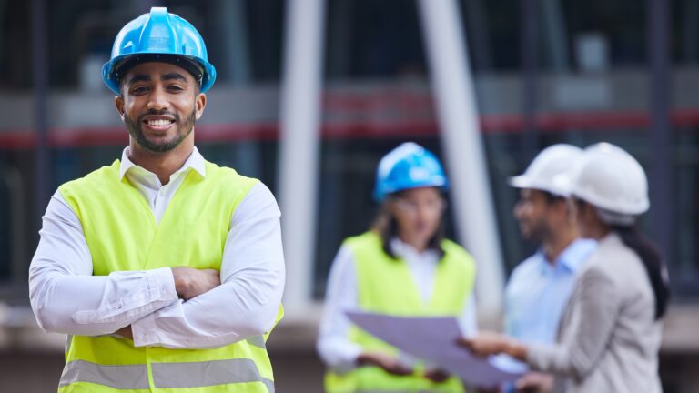 Safety professional smiling who has an EHS certification.
