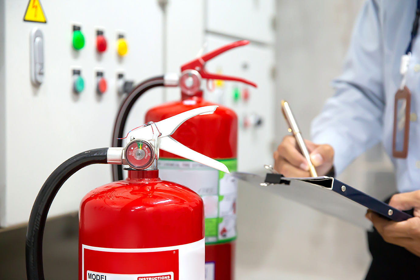 Engineer,Are,Checking,Fire,Extinguishers,In,The,Fire,Control,Room