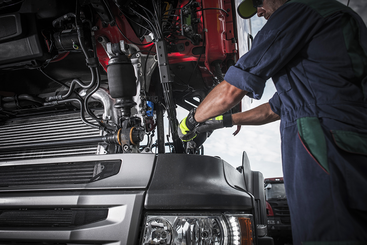 Repairing,Broken,Semi,Truck,Tractor,Engine.,Caucasian,Trucks,Mechanic.