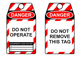 Lockout tagout tag Man going through a checklist