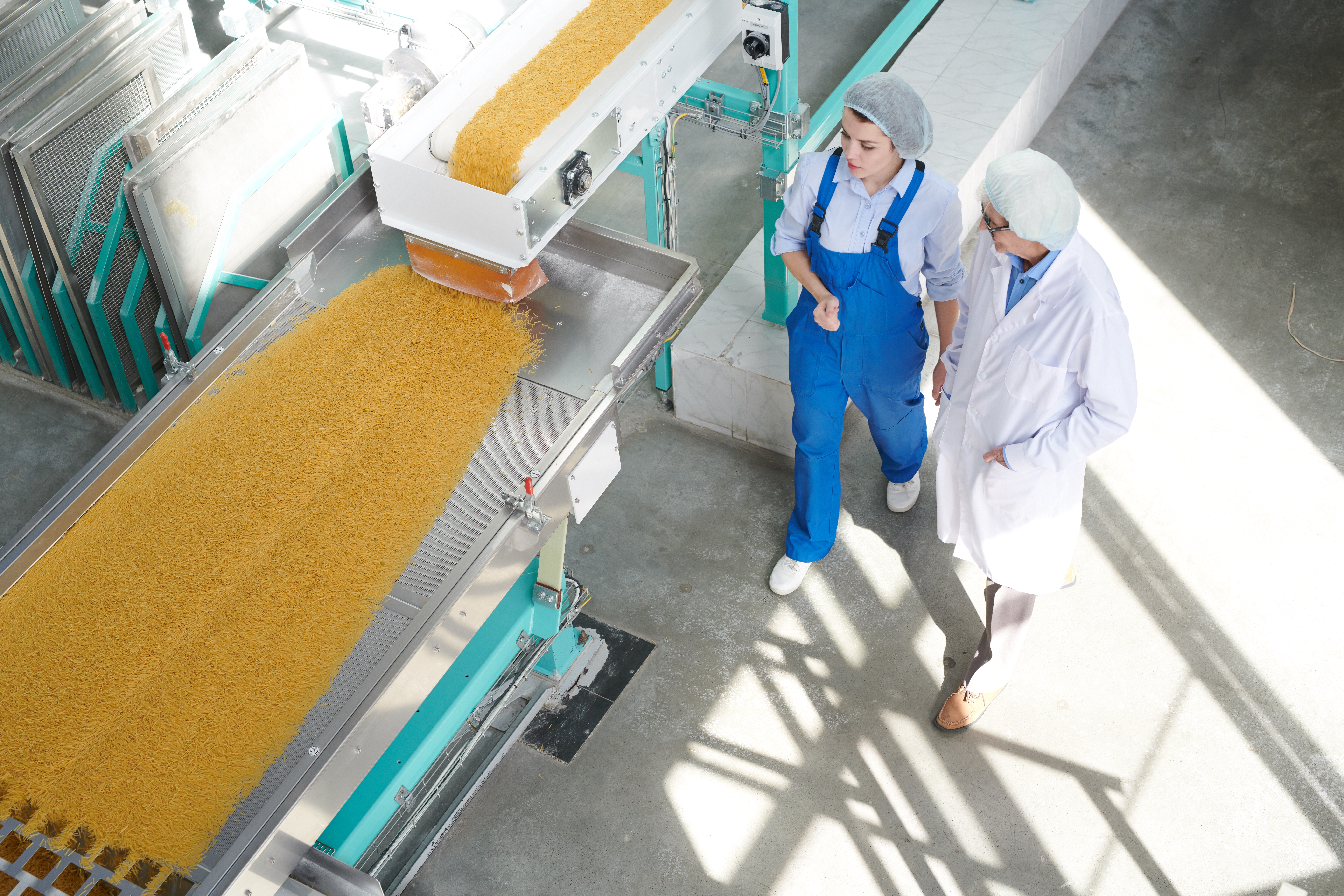 Two Workers at Food Factory Background