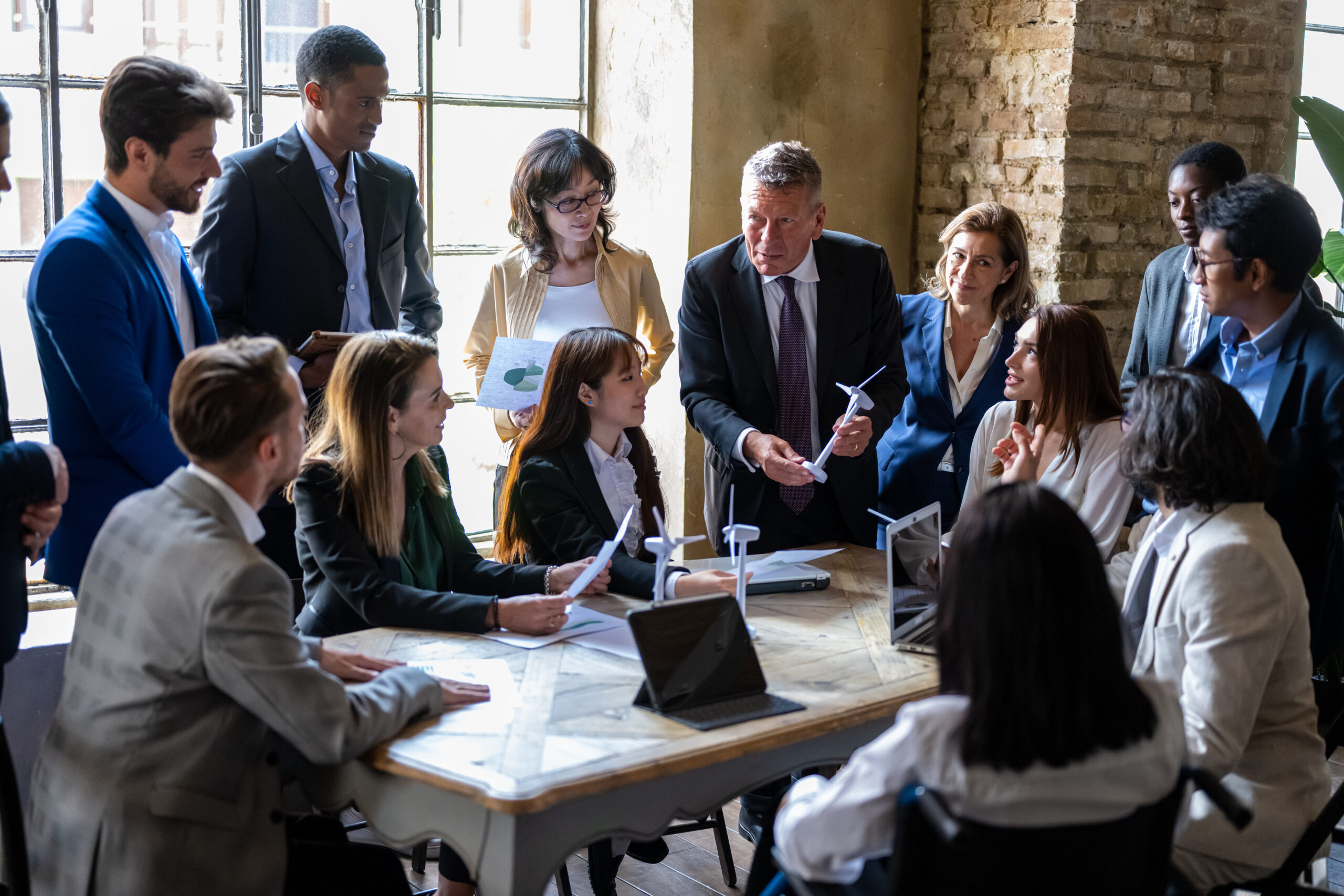 52 Safety Tips of the Week - Meeting of entrepreneurs and engineers at the discussion table on energy projects from renewable and sustainable sources for the environment, international teamwork briefing