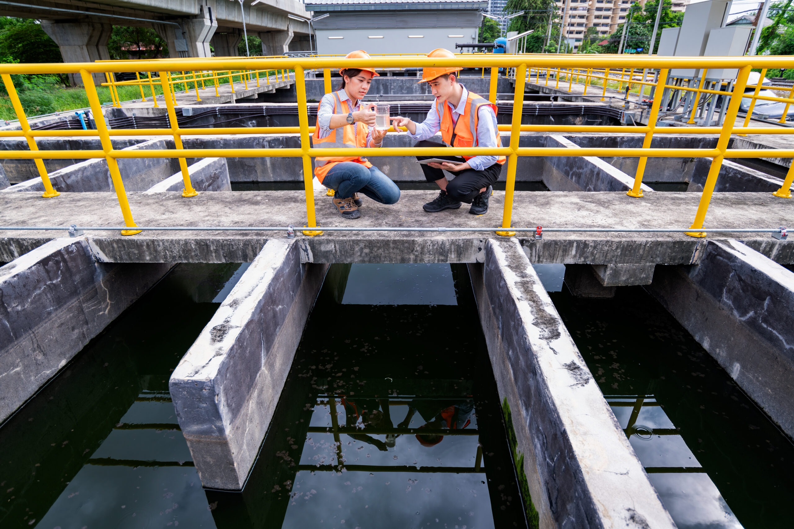 chemicals for wastewater treatment - engineer-take-water-from-wastewater-treatment-pond-2025-04-02-19-09-14-utc