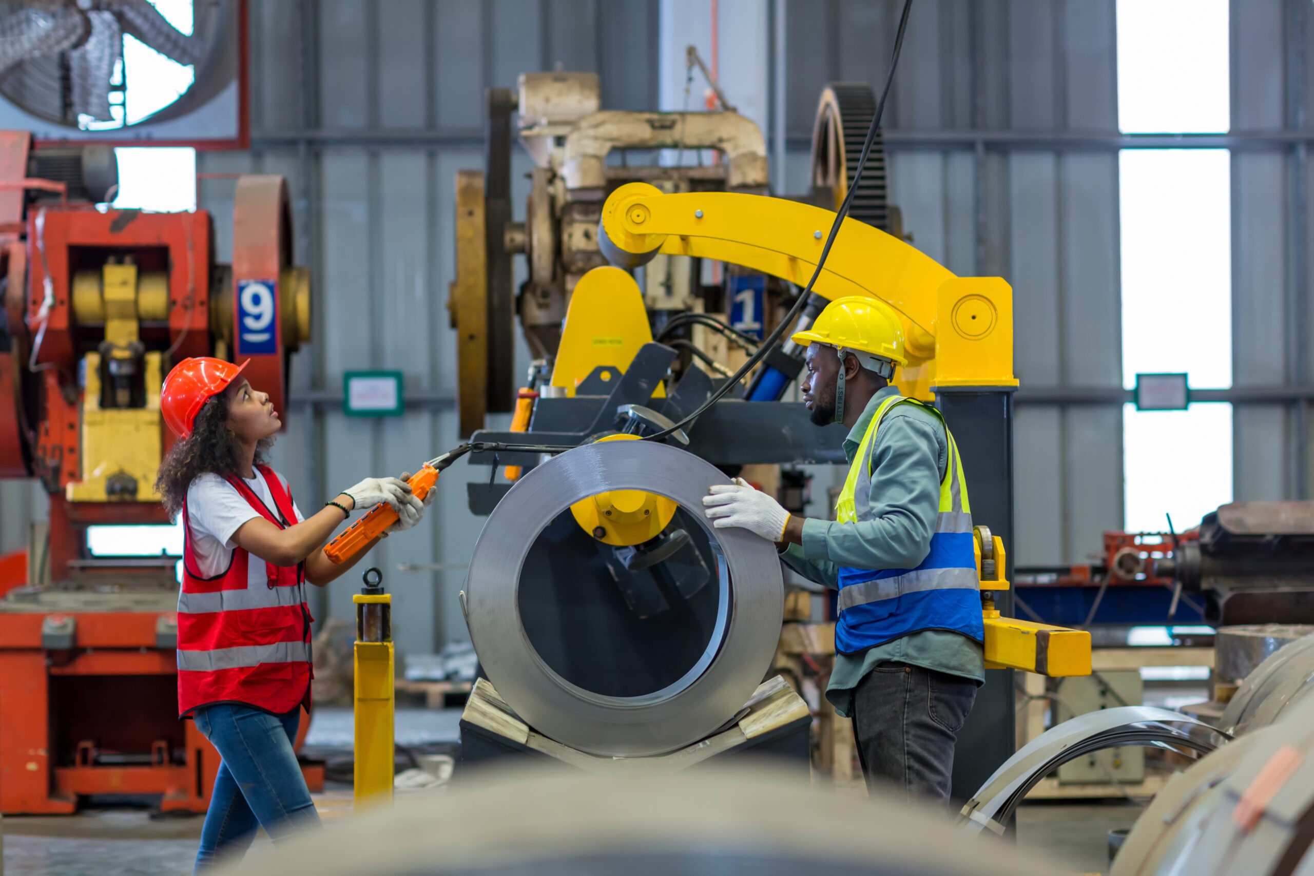 Foreman and worker conducting change management in the workplace.