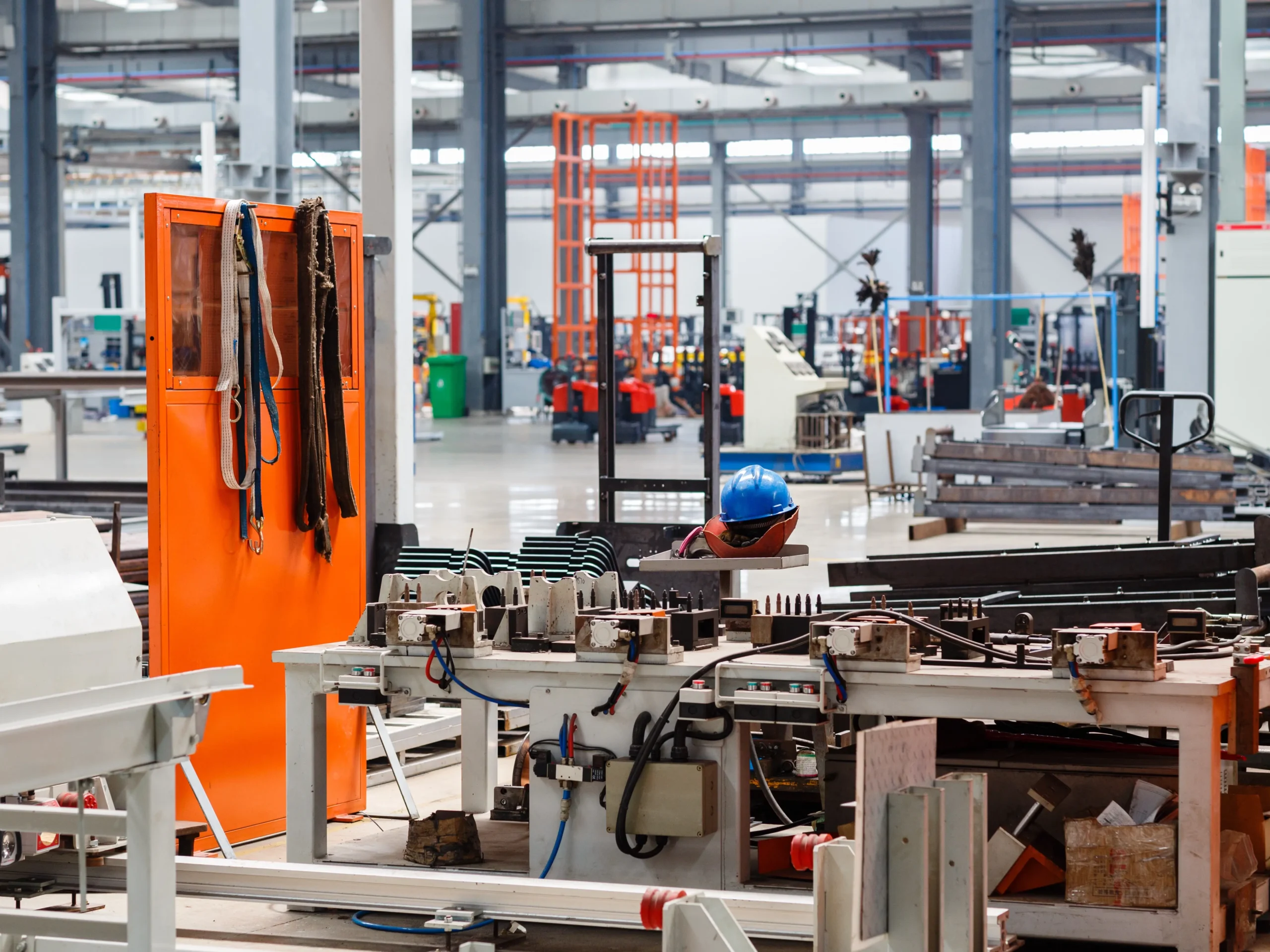 Clean, modern manufacturing environment with large pieces of equipment.